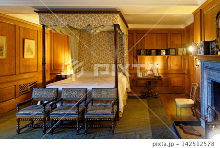 Historic Four Poster Canopy Bed in Wood Paneled Castle Bedroom Historic Four Poster Canopy Bed in Wood Paneled Castle Bedroom 142512578