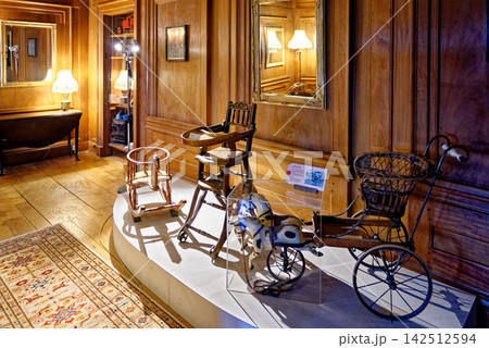 Historic Children Nursery Exhibition with Vintage Toys and Highchair 142512594