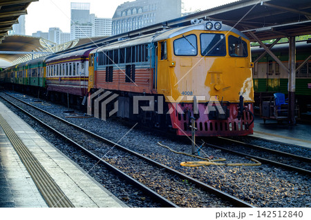 Vintage Yellow Locomotive at Train Station Platform in Evening Light 142512840