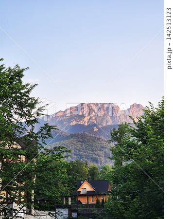 A cosy street in Poronin, a Polish village near Zakopane, in the area around Koszne Hamr Street. A peaceful rural scene near the Tatra Mountains. A cosy street in Poronin, a Polish village near Zakopane, in the area around Koszne Hamr Street. A peaceful rural scene near the Tatra Mountains. 142513123