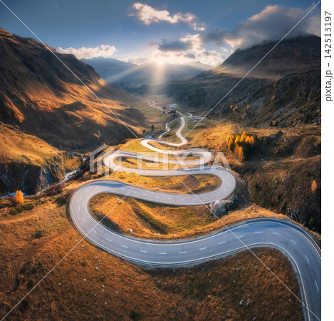 Aerial view of winding mountain road in the Swiss Alps Aerial view of winding mountain road in the Swiss Alps 142513197