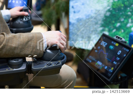 Man operating advanced joystick controller in tech demo 142513669
