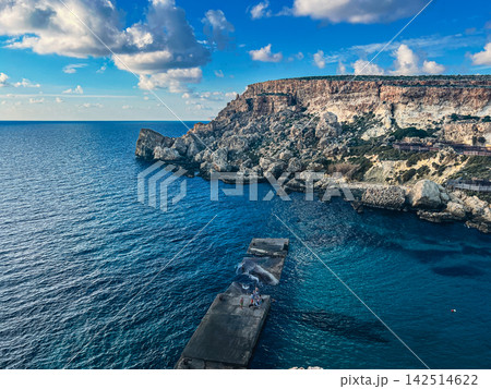 Scenic View of Anchor Bay Pier and Popeye Village Cliffs in Malta 142514622