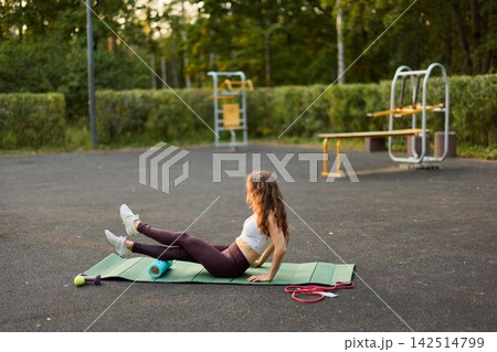 Outdoor fitness session focused on mobility and recovery Outdoor fitness session focused on mobility and recovery 142514799