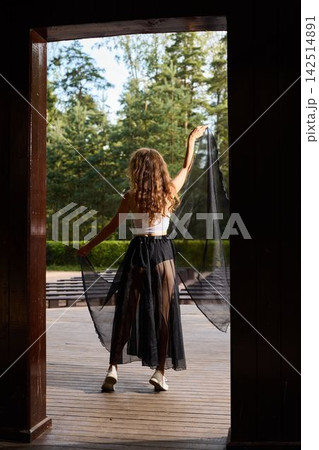 Contemplative dancer in natural setting with light and movement Contemplative dancer in natural setting with light and movement 142514891