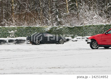 Red and black vehicles perform synchronized tight passing Red and black vehicles perform synchronized tight passing 142514952