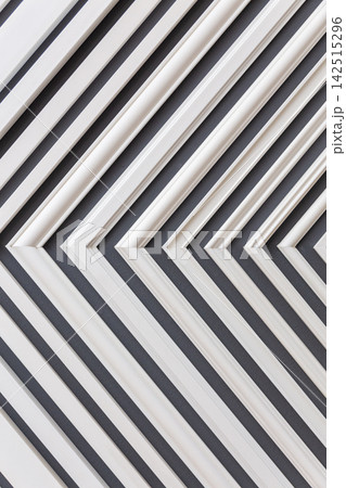 white plastic slats forming a repeating diagonal pattern white plastic slats forming a repeating diagonal pattern 142515296