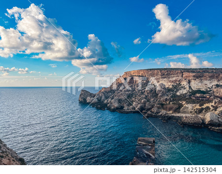 Deep Blue Waters and Coastal Cliffs at Anchor Bay Mellieha Malta 142515304