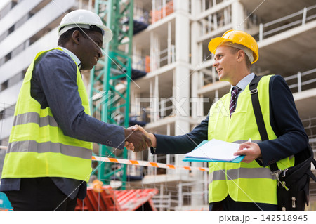 Engineers shaking hands on construction site Engineers shaking hands on construction site 142518945