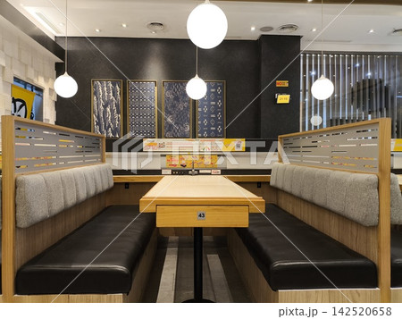 Modern cafe interior with cozy booth seating Modern cafe interior with cozy booth seating 142520658