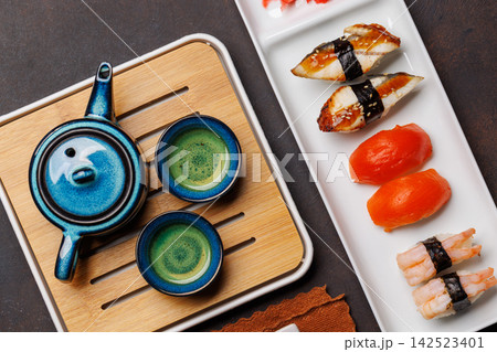 Sushi set with tea and small teapot Sushi set with tea and small teapot 142523401
