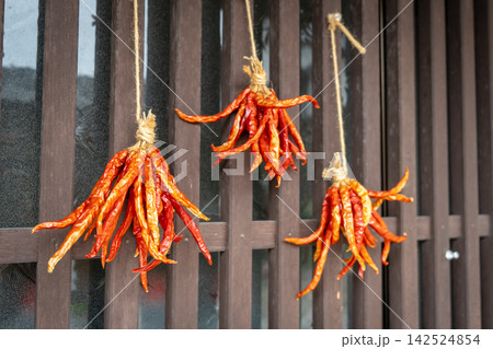 Drying chili peppers in Magome village on the Nakasendo trail Drying chili peppers in Magome village on the Nakasendo trail 142524854