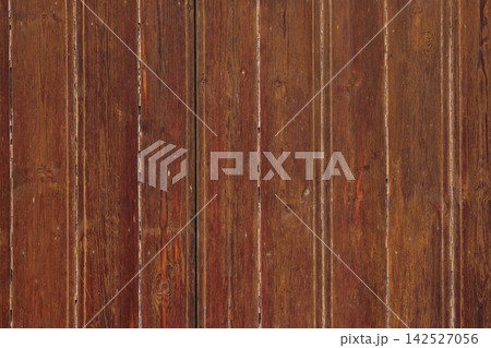 Weathered dark brown wood surface with vertical wooden planks. Abstract rustic background of aged timber wall Weathered dark brown wood surface with vertical wooden planks. Abstract rustic background of aged timber wall 142527056