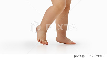 Close view of toddler legs taking first steps. 142529912