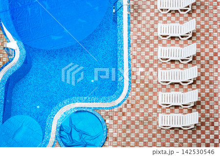 swimming pool and deck chairs, top view swimming pool and deck chairs, top view 142530546