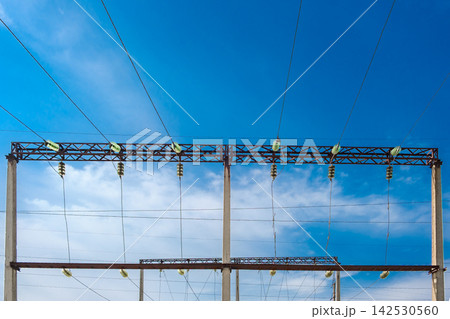 electrical wires with insulators on concrete supports electrical wires with insulators on concrete supports 142530560