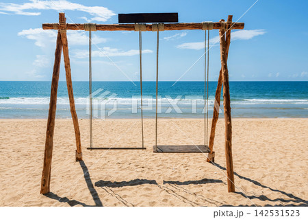 swing on Baan Krood sandy beach facing blue ocean, Bang Saphan swing on Baan Krood sandy beach facing blue ocean, Bang Saphan 142531523
