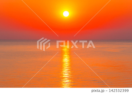 sunrise at the black sea. sun above horizon. reflection on the calm water. nature background in warm orange light sunrise at the black sea. sun above horizon. reflection on the calm water. nature background in warm orange light 142532399