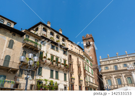 Torre del Gardello and Palazzo Maffei in Piazza delle Erbe under Blue Sky in Verona City Italy Torre del Gardello and Palazzo Maffei in Piazza delle Erbe under Blue Sky in Verona City Italy 142533153