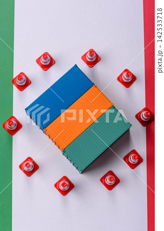 The cargo container ban on the Italian flag as a conceptual backdrop. Cargo container embargo The cargo container ban on the Italian flag as a conceptual backdrop. Cargo container embargo 142533718