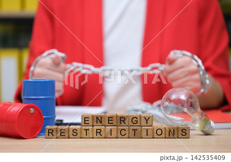 Energy restrictions create a visual representation of limitations and challenges in modern industry and daily life Energy restrictions create a visual representation of limitations and challenges in modern industry and daily life 142535409