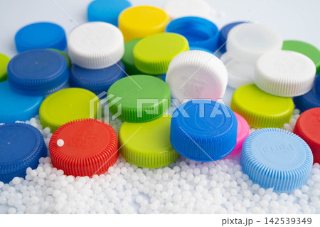 Bangkok, Thailand April 20, 2024 Plastic recycle pellets and caps for industrial use. Bangkok, Thailand April 20, 2024 Plastic recycle pellets and caps for industrial use. 142539349