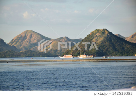 A beautiful seascape with steep hills in Labuan Bajo, Indonesia. A beautiful seascape with steep hills in Labuan Bajo, Indonesia. 142539383