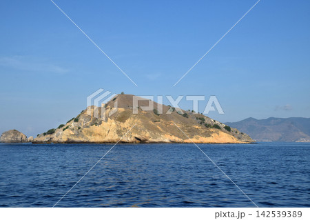 A beautiful seascape with steep hills in Labuan Bajo, Indonesia. A beautiful seascape with steep hills in Labuan Bajo, Indonesia. 142539389