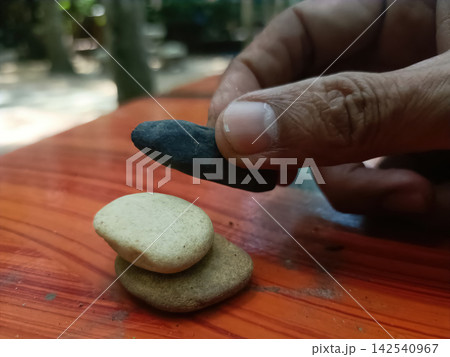 Dark stone hand wooden table Dark stone hand wooden table 142540967