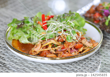 salmon salad, spicy salmon salad or spicy salad or spicy seafood salad with cashew and sunflower sprout 142545835
