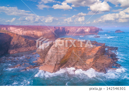 Rocky sea coast at sunrise. Beach Playa de Las Catedrales in Ribadeo, Spain, Europe. Aerial view 142546301