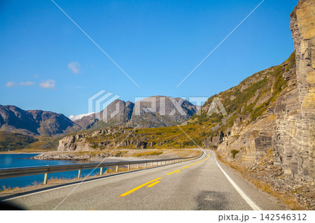 The road along the fjord. The road to the North Cape, Norway The road along the fjord. The road to the North Cape, Norway 142546312