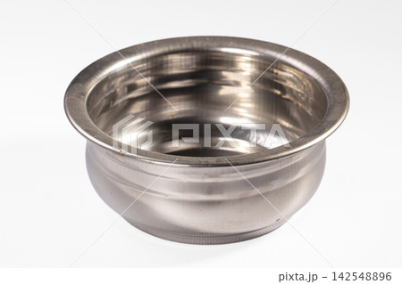 Empty stainless steel bowl on white background, reflective surface, shallow depth of field Empty stainless steel bowl on white background, reflective surface, shallow depth of field 142548896