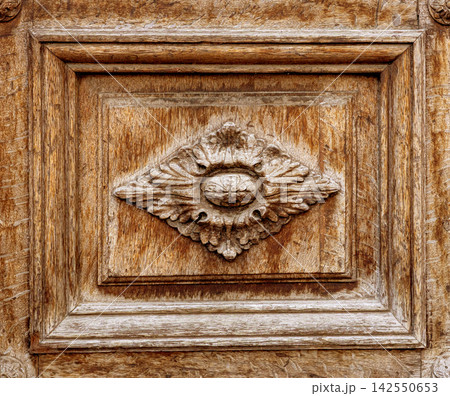 Decorative wood panel showing ornate floral carving Decorative wood panel showing ornate floral carving 142550653
