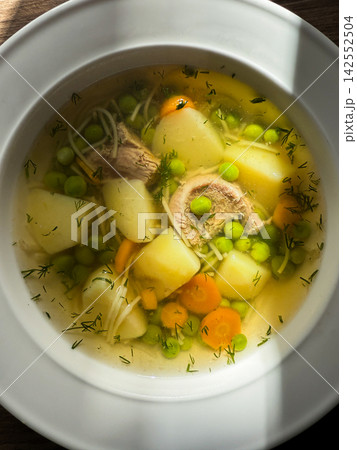 Homemade chicken noodle soup with mixed vegetables Homemade chicken noodle soup with mixed vegetables 142552504