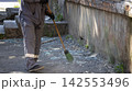 Municipal Service Worker Sweeping Broken Glass Shards 142553496