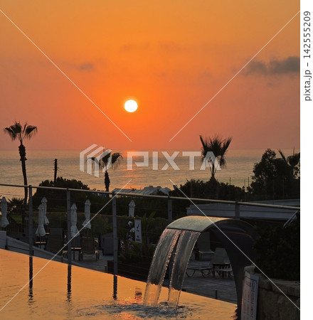 Golden hour ocean sunset view from a beach resort villa 142555209