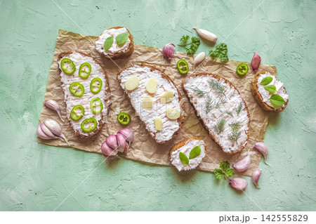 Traditional lard spread smalec sandwiches on rustic bread with garlic and jalapenos Traditional lard spread smalec sandwiches on rustic bread with garlic and jalapenos 142555829