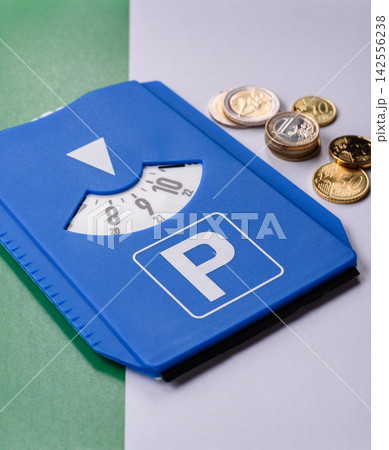 A parking disc, permit, or ticket for measuring time and paying municipal services. A parking disc 142556238