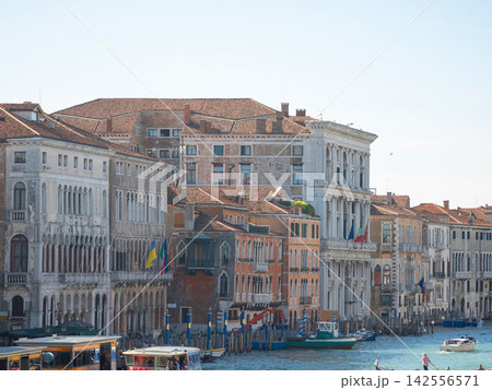 Landscape with Rialto Bridge and gondola Grand Canal in Venice, Italy, Europe. 142556571