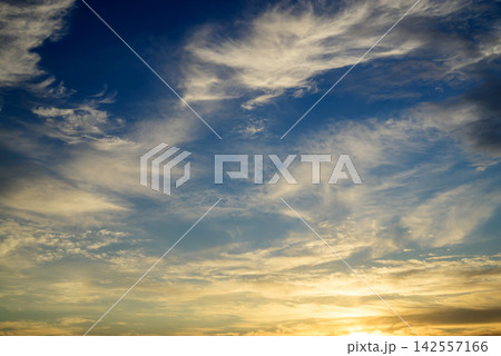 golden sunrise with white clouds and sunlight golden sunrise with white clouds and sunlight 142557166