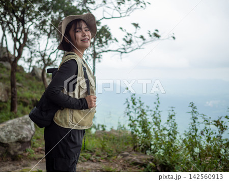 young woman in hat and dress in nature 142560913