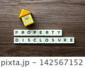 Property disclosure concept with wooden toy house 142567152