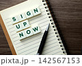 Sign up now message with pen on notebook 142567153