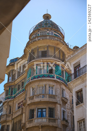 Historic Casablanca building with colorful mosaic dome and curved balconies in Morocco 142569227