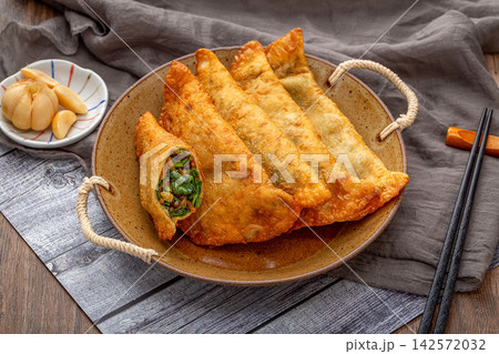 traditional Chinese Deep Fried Vegetable Dumplings, Crispy Golden Cai Jiao Pastry with Herb Filling traditional Chinese Deep Fried Vegetable Dumplings, Crispy Golden Cai Jiao Pastry with Herb Filling 142572032