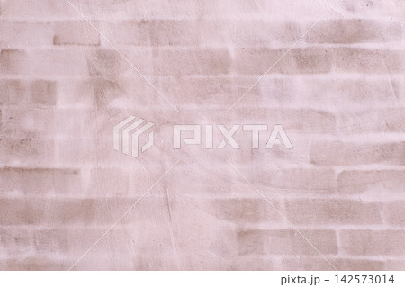 Pale pink wall featuring an abstract brick pattern creating a soft, textured background with subtle variations in color and tone, ideal for design elements Pale pink wall featuring an abstract brick pattern creating a soft, textured background with subtle variations in color and tone, ideal for design elements 142573014