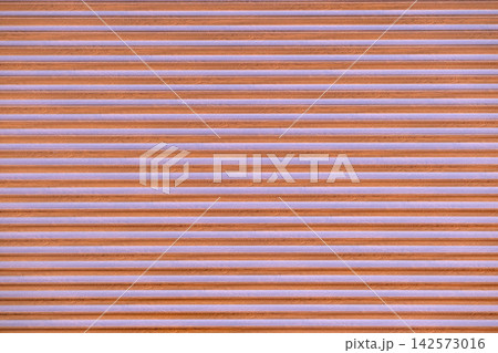 Alternating horizontal stripes of brown wood grain and light purple creating a textured background and repeating linear pattern 142573016