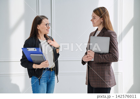 Teacher and a school principal discuss educational plans Teacher and a school principal discuss educational plans 142576011