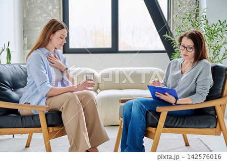 Individual psychological consultation, upset female patient with a professional therapist Individual psychological consultation, upset female patient with a professional therapist 142576016